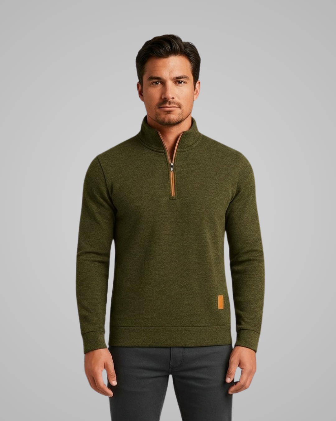 Man wearing a green pullover with a zipper on a gray background