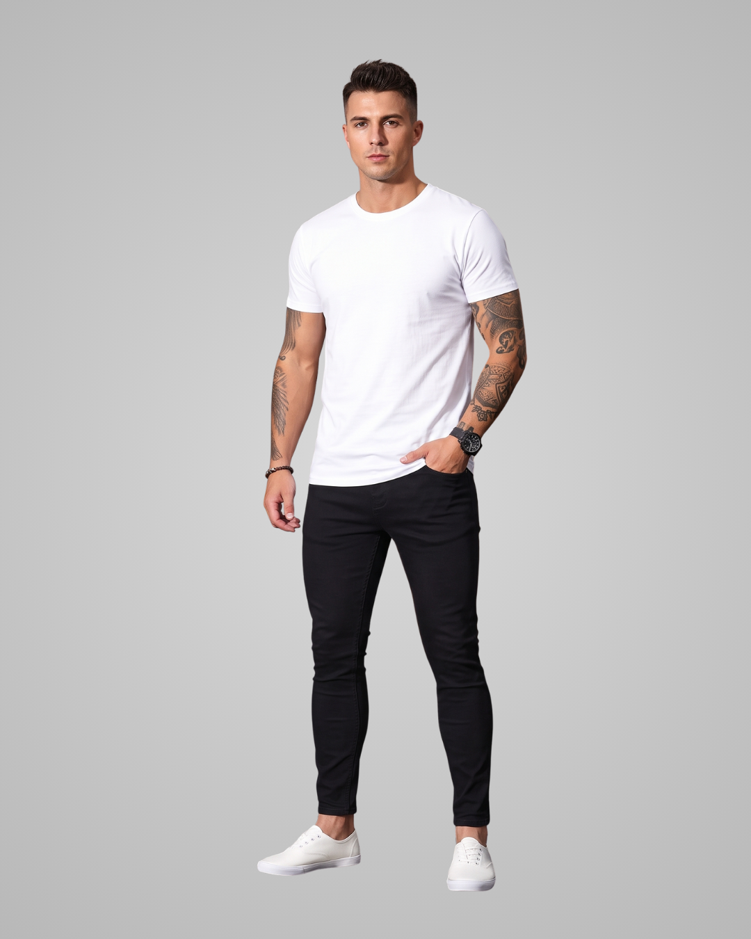 Man wearing a white t-shirt, black pants, and white sneakers on a gray background