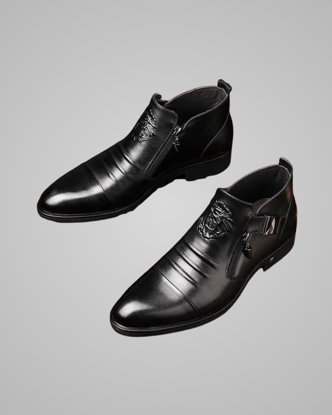 Pair of black leather dress shoes on a gray background