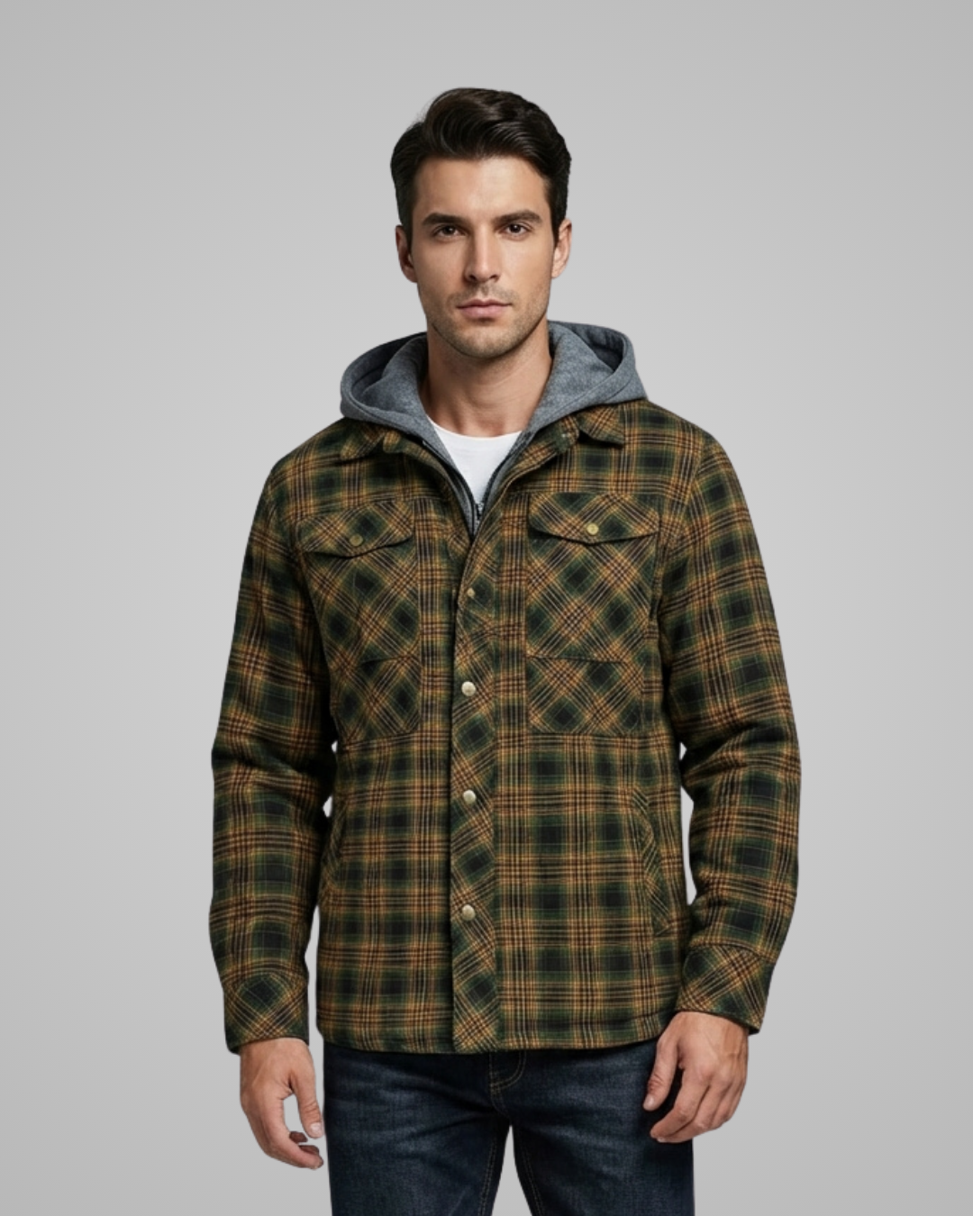 Man wearing a plaid jacket with a gray hood against a gray background
