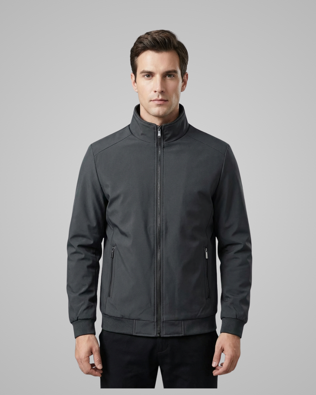 Man wearing a gray jacket on a gray background