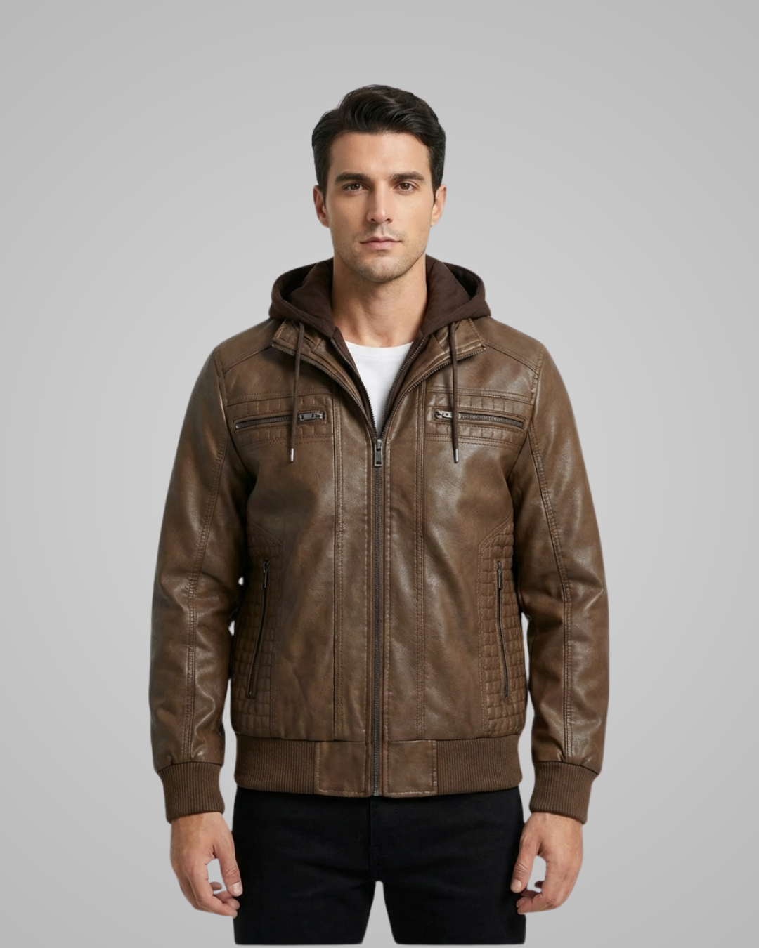Man wearing a brown leather jacket with a hood on a gray background