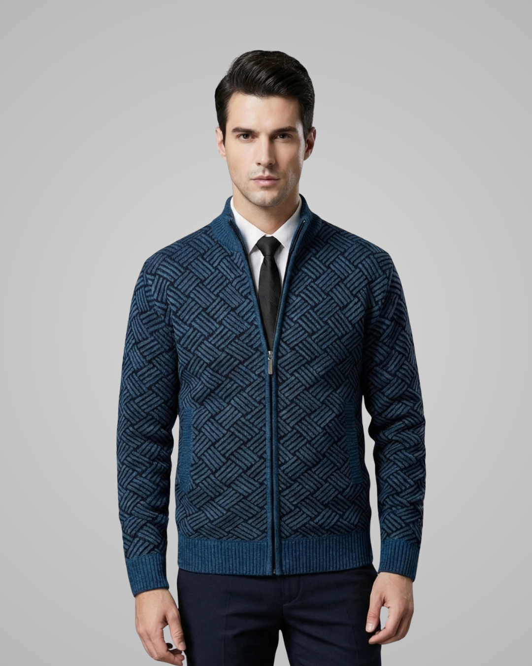 Man wearing a blue patterned jacket on a gray background