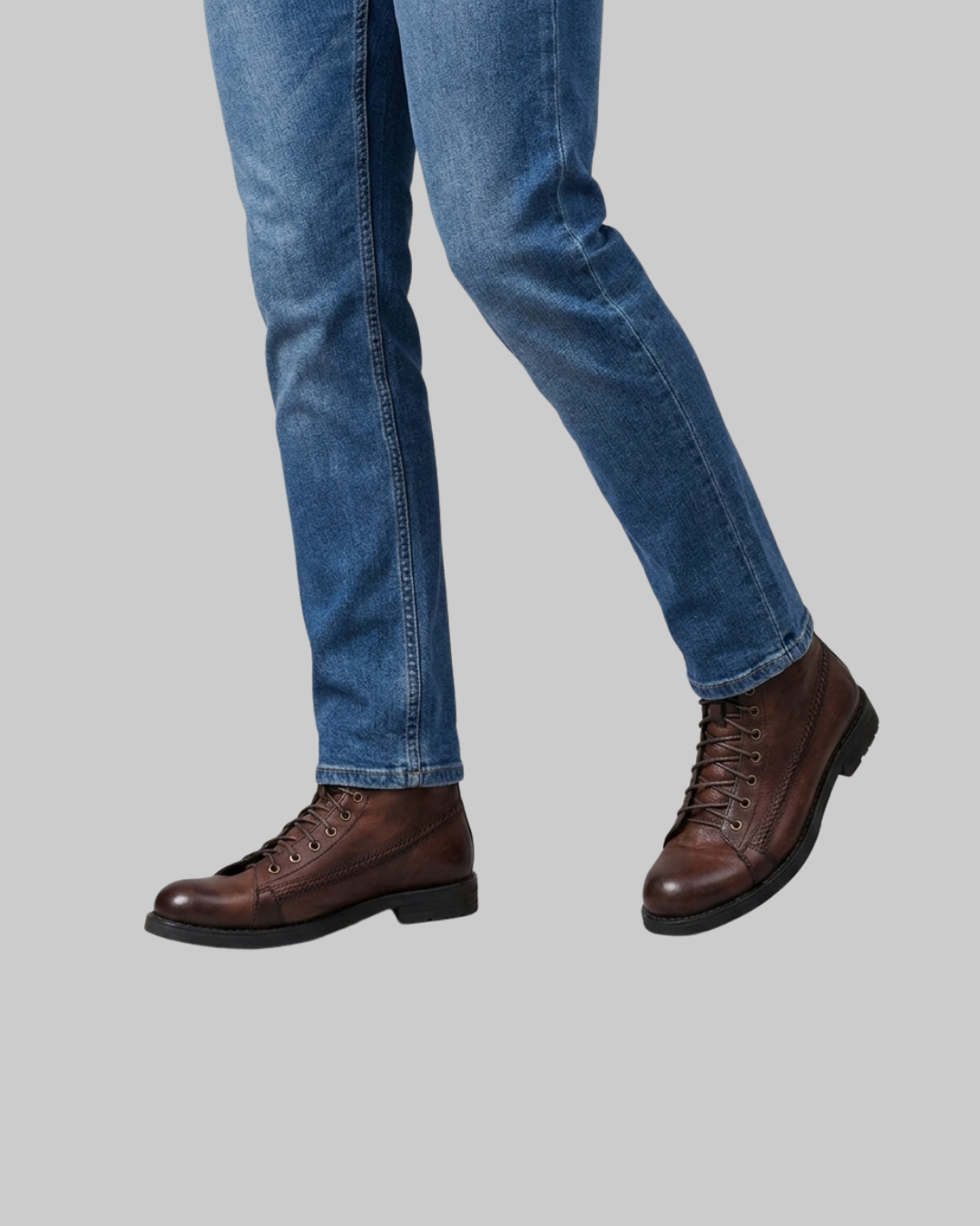 Worn Men's Braided Stitch Lace-Up Boots in brown.