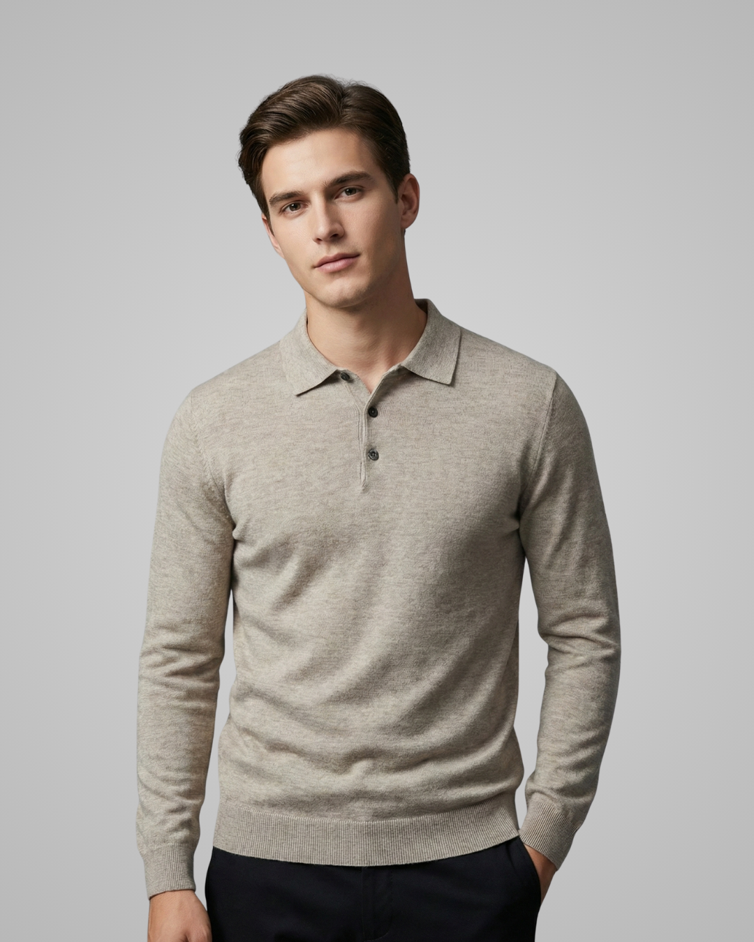 Man wearing a beige long-sleeve polo shirt against a plain background