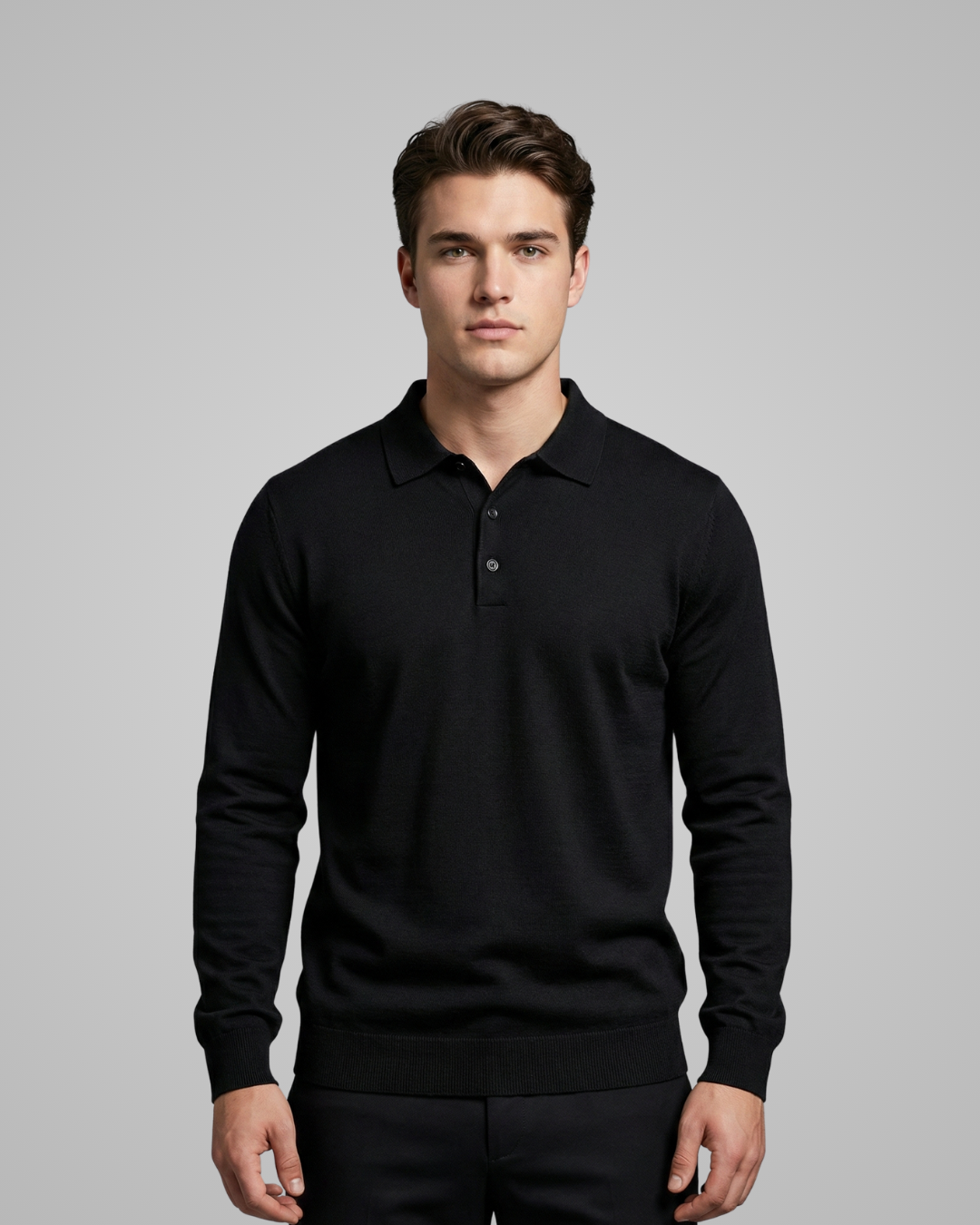Man wearing a black long-sleeve polo shirt against a gray background