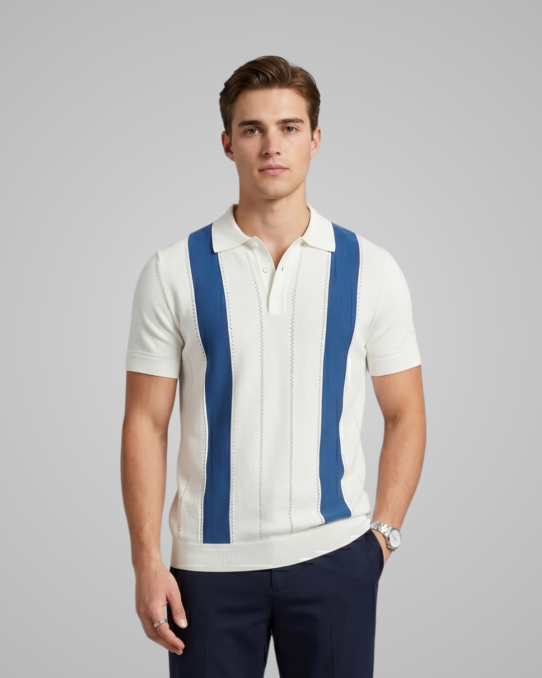 Man wearing a white polo shirt with blue suspenders on a gray background