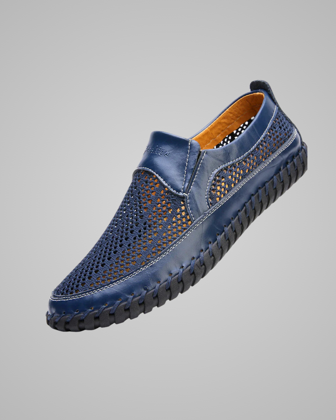 Blue perforated shoe on a gray background