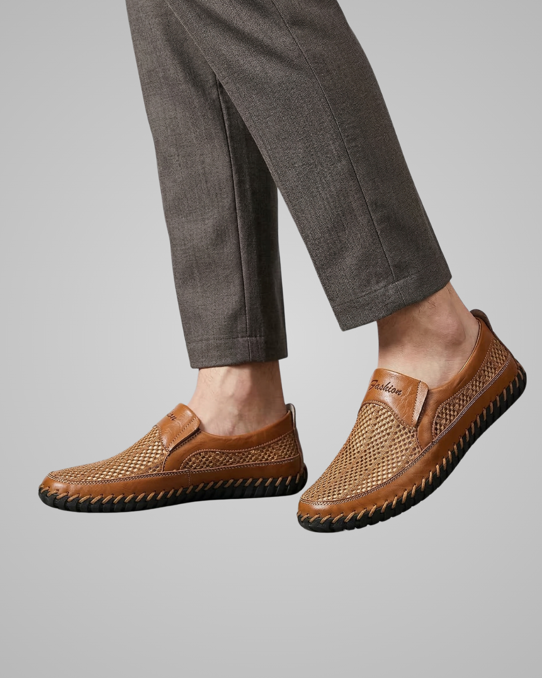 Brown woven shoes worn with gray pants on a light gray background
