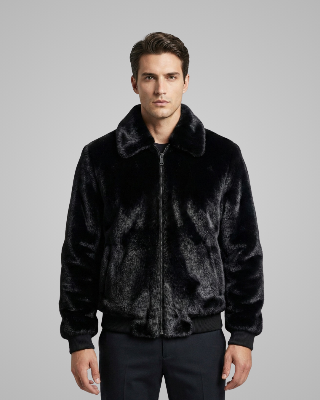 Man wearing a black fur jacket against a gray background