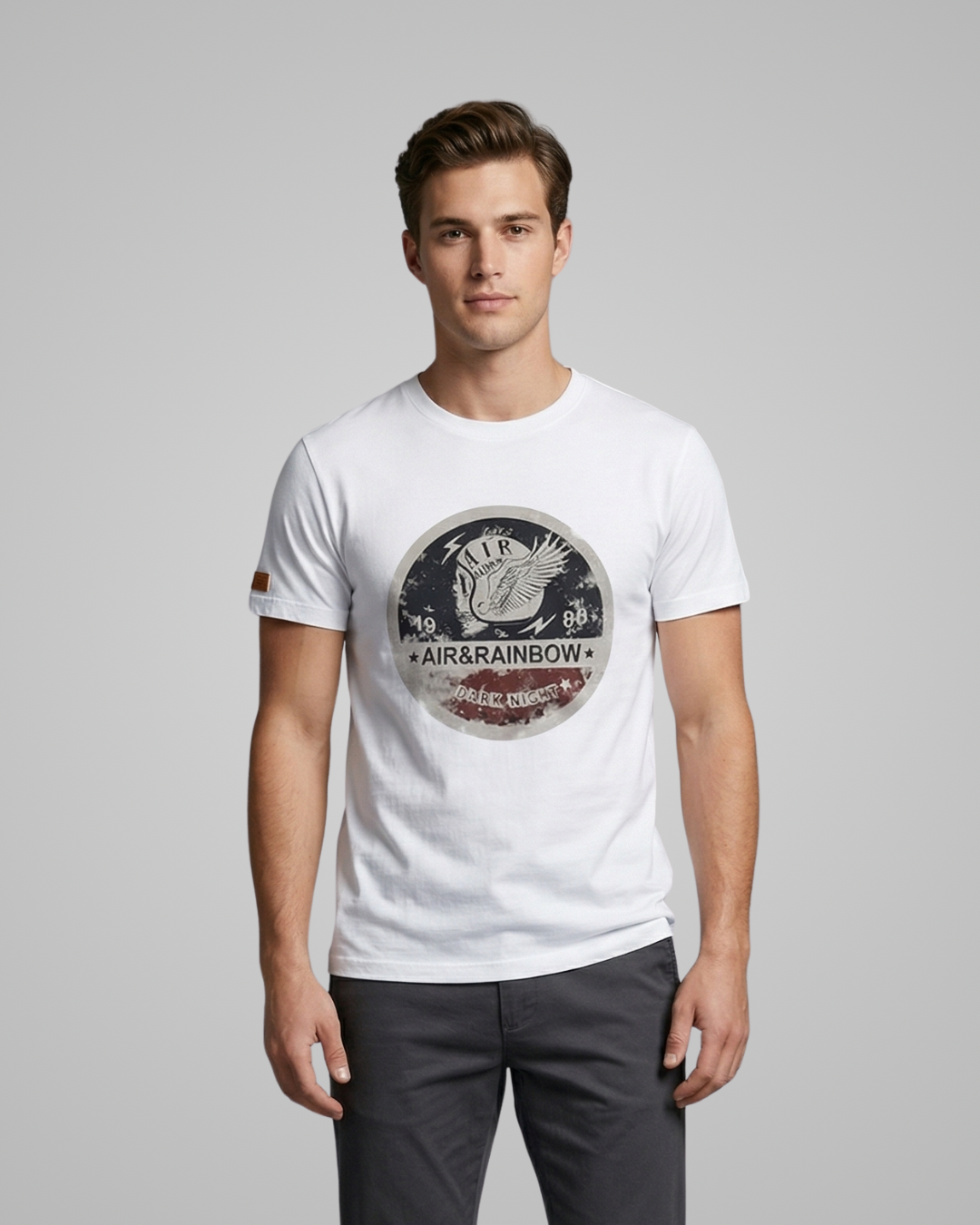 Man wearing a white t-shirt with a graphic design on a gray background