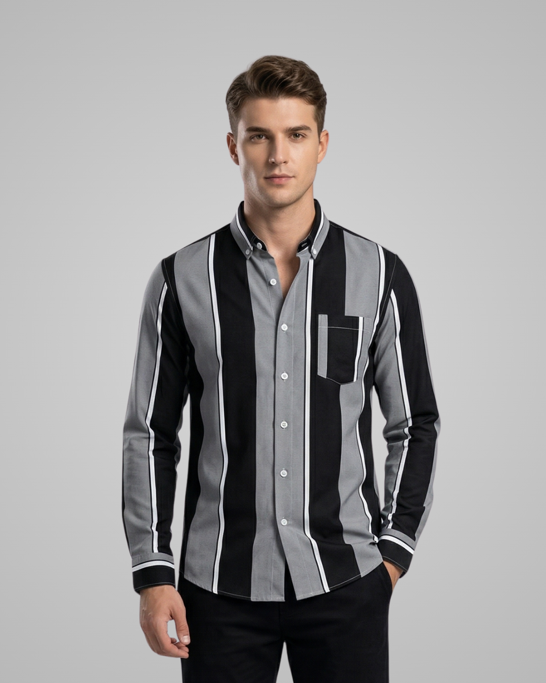 Man wearing a black, gray, and white striped shirt on a gray background