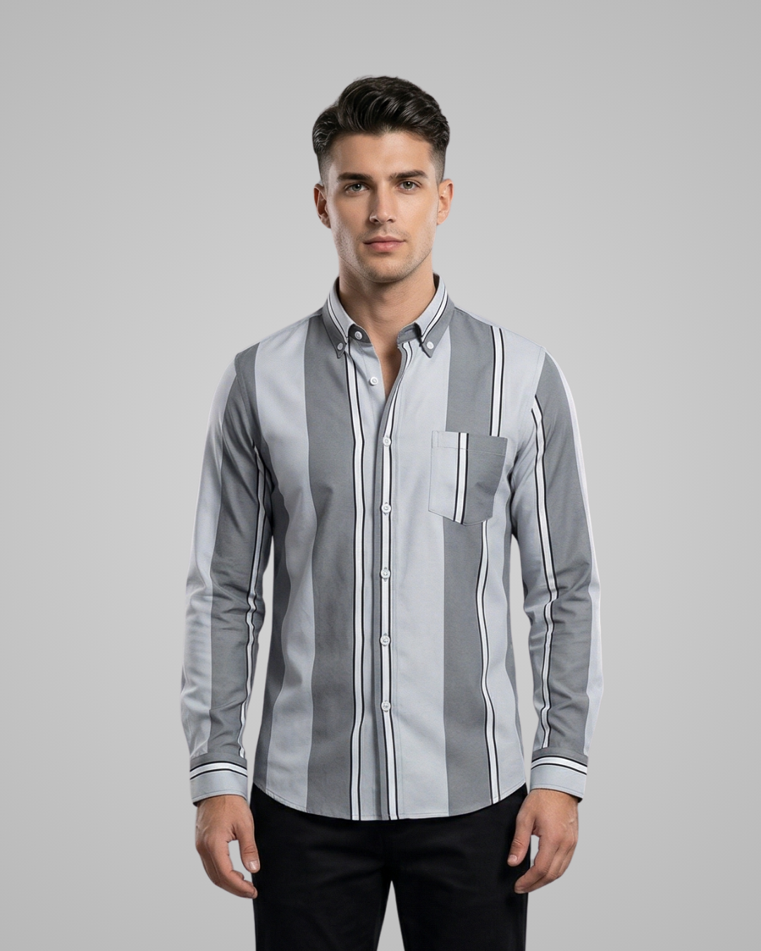 Man wearing a gray and white striped shirt on a gray background