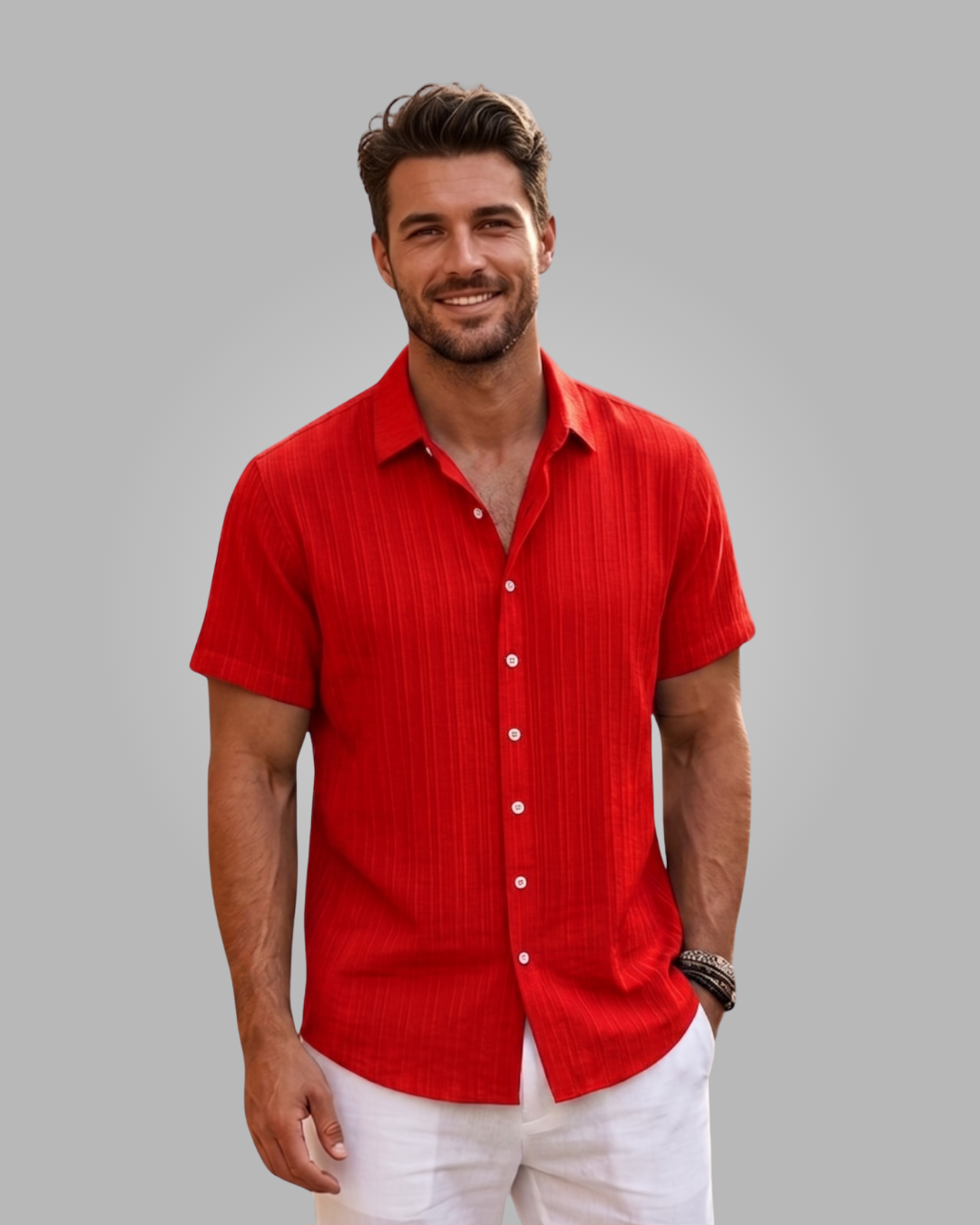 Man wearing a red short-sleeve shirt against a gray background
