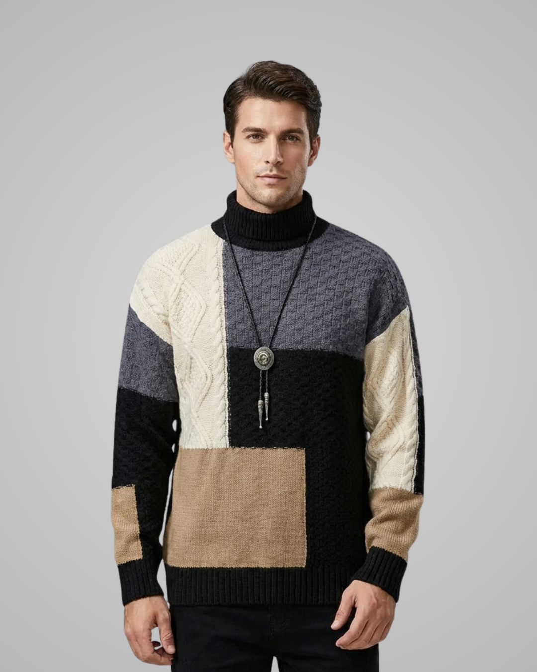 Man wearing a patterned sweater with a gray background