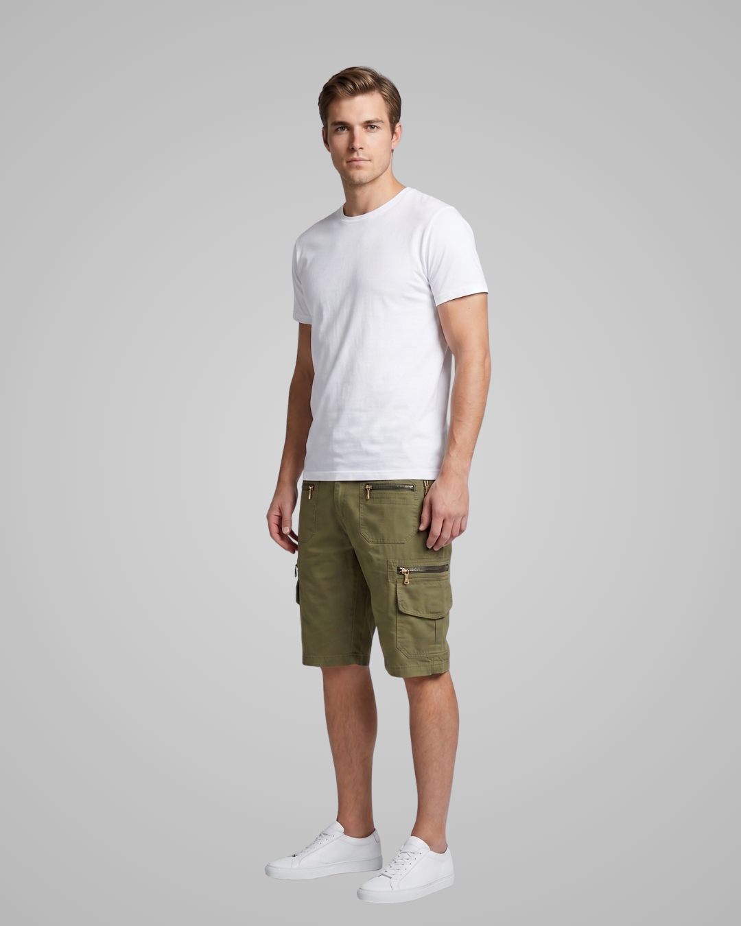 Man wearing a white t-shirt and green cargo shorts on a gray background