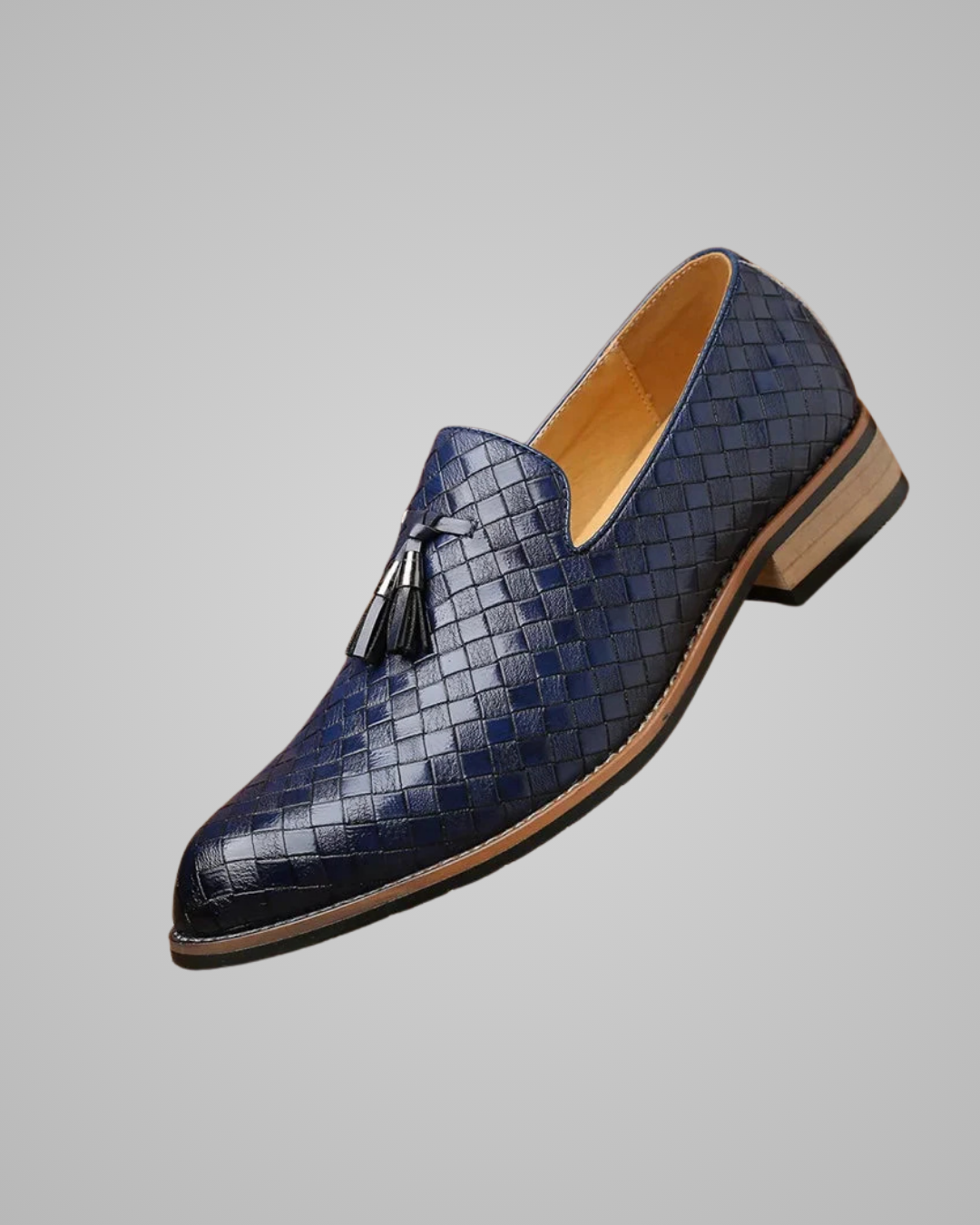 Blue woven loafer with tassel on a gray background