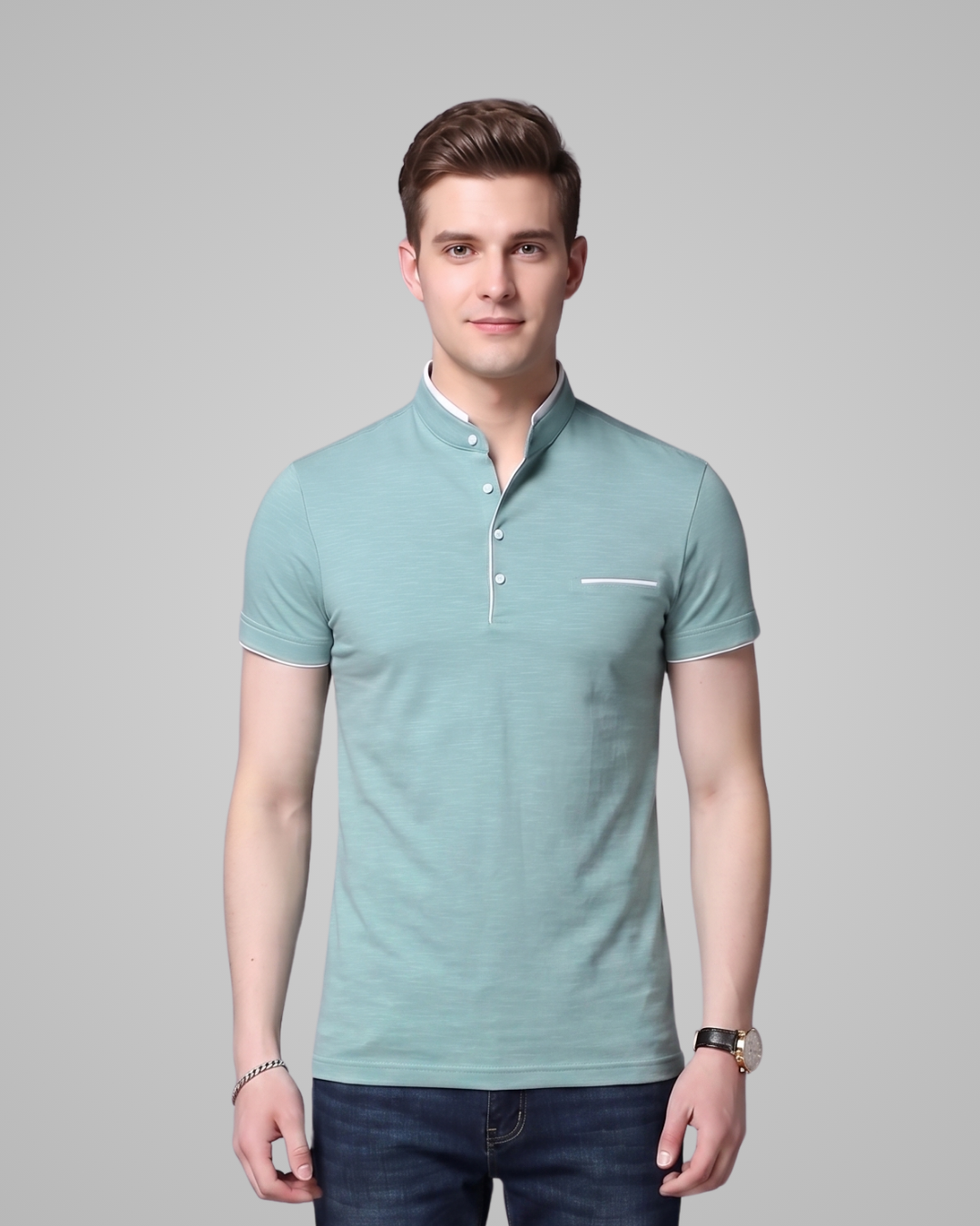 Man wearing a light blue polo shirt against a gray background