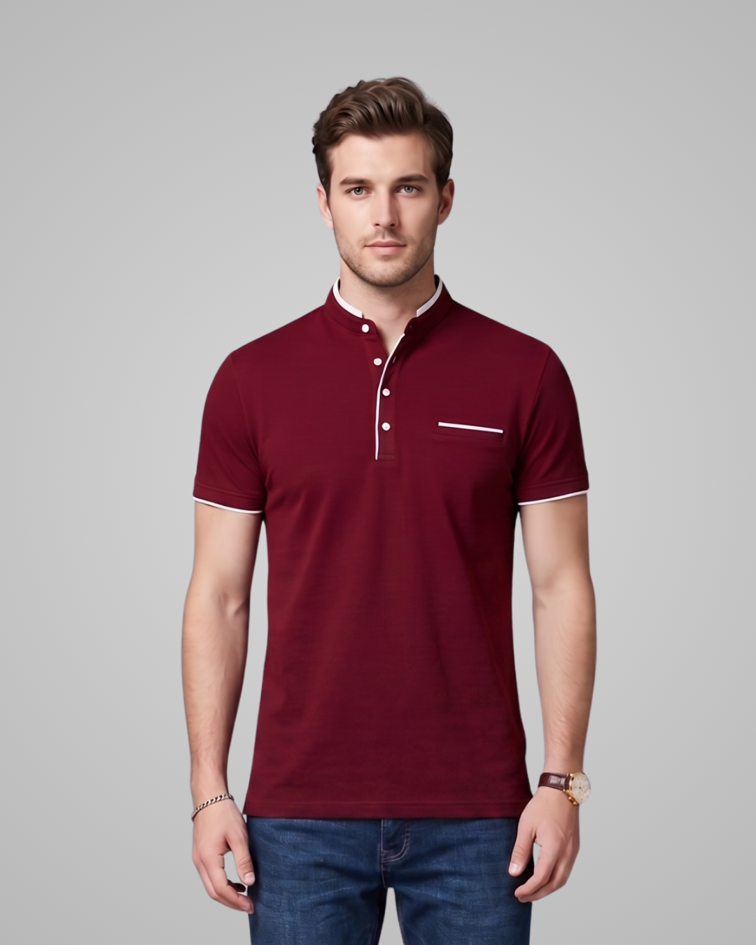 Man wearing a maroon polo shirt with white trim on a gray background