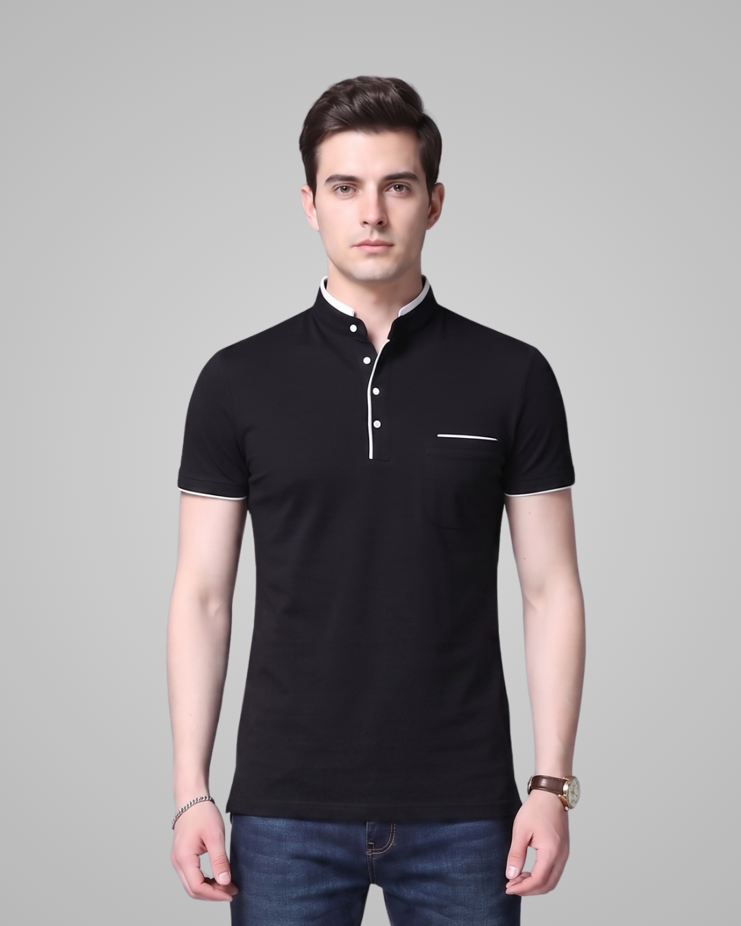 Man wearing a black polo shirt with white trim on a gray background