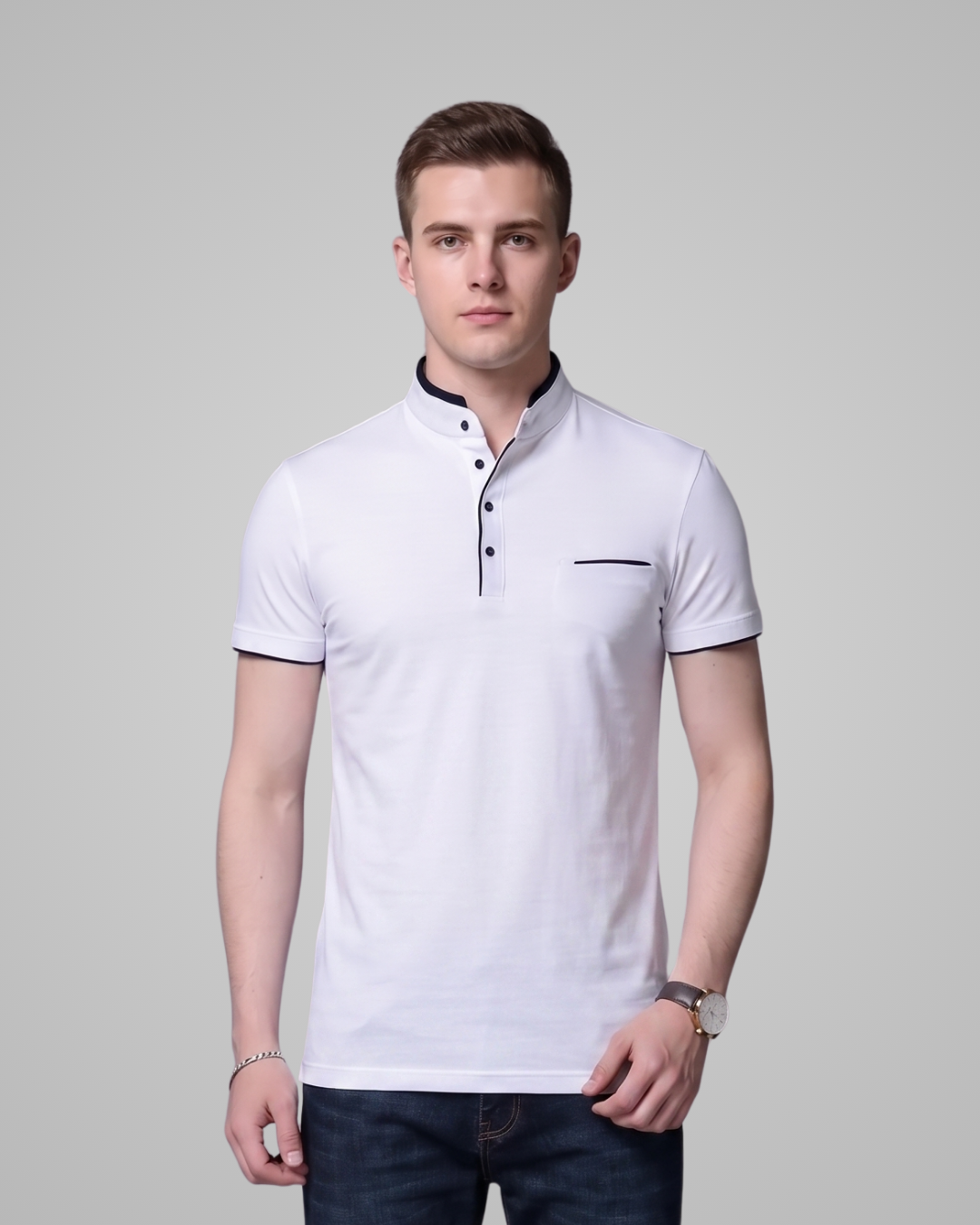 Man wearing a white polo shirt with black accents on a gray background