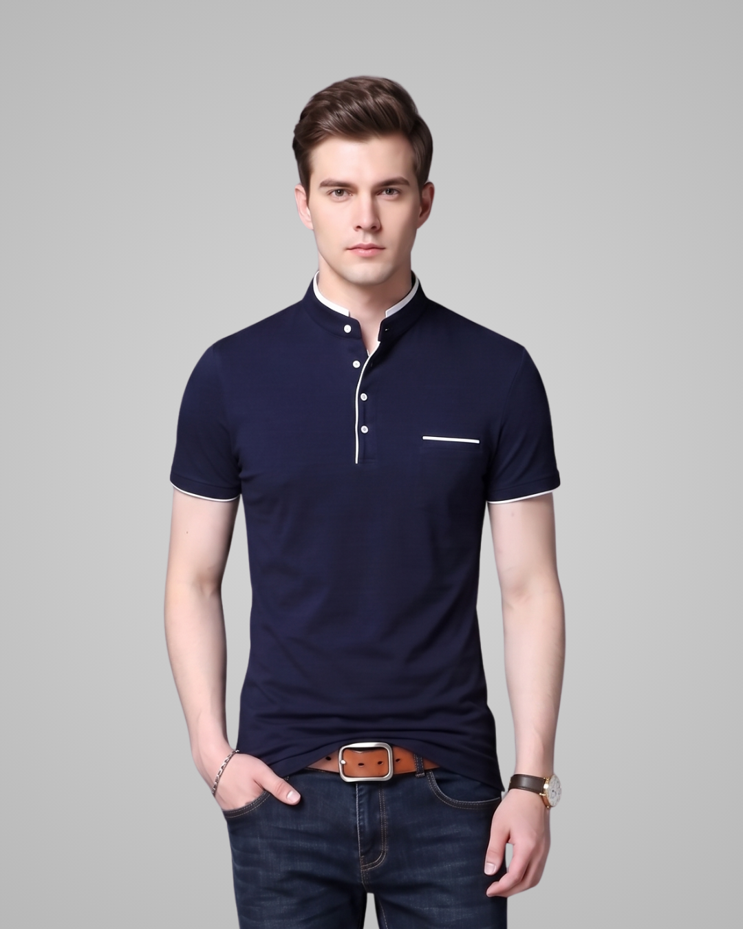 Man wearing a navy blue polo shirt with a gray background