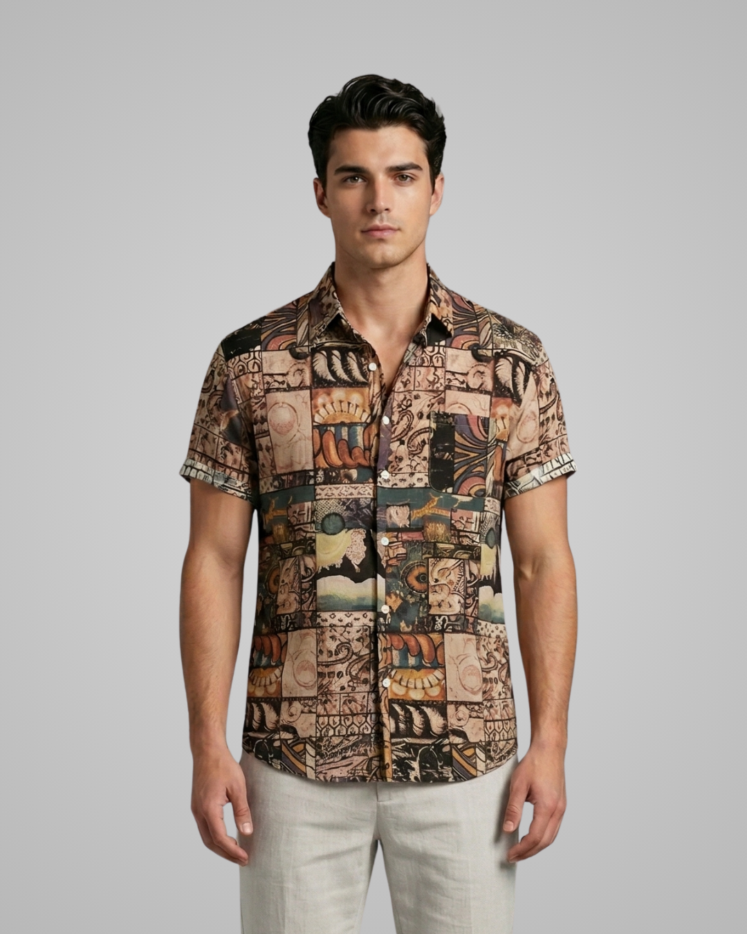 Man wearing a patterned shirt against a gray background