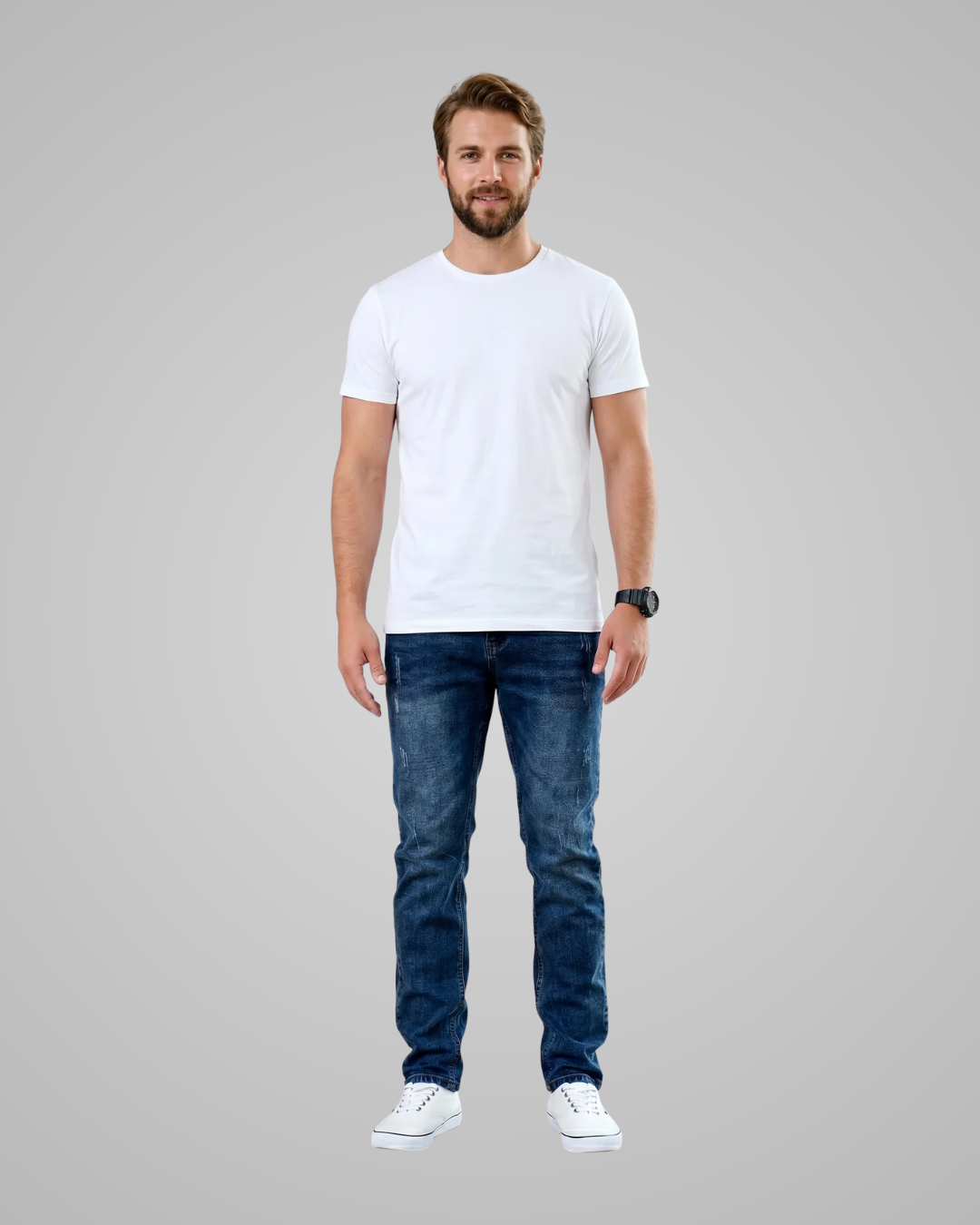 Man wearing a plain white t-shirt and blue jeans on a gray background