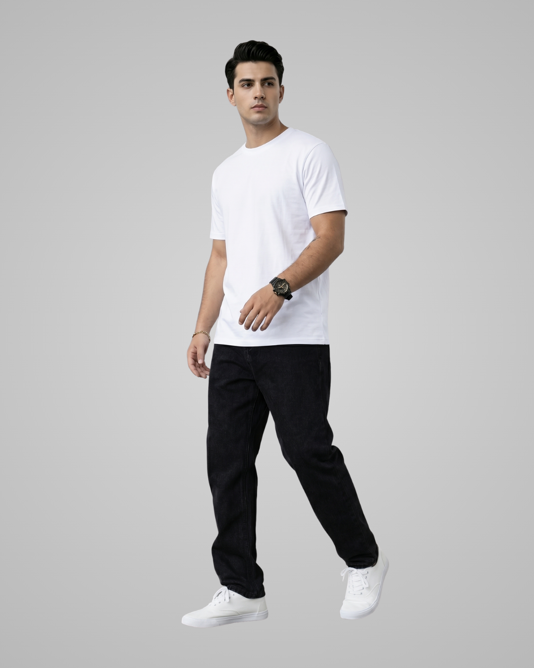 Man wearing a white t-shirt, black pants, and white sneakers on a gray background